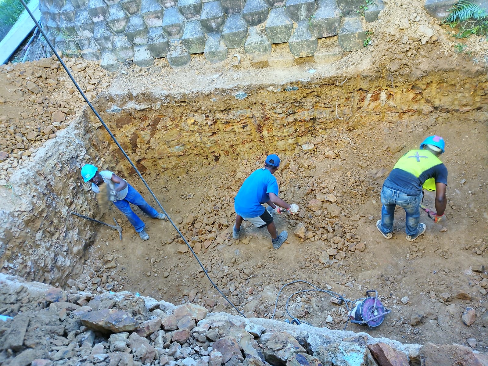 Team working in the excavated foundation area