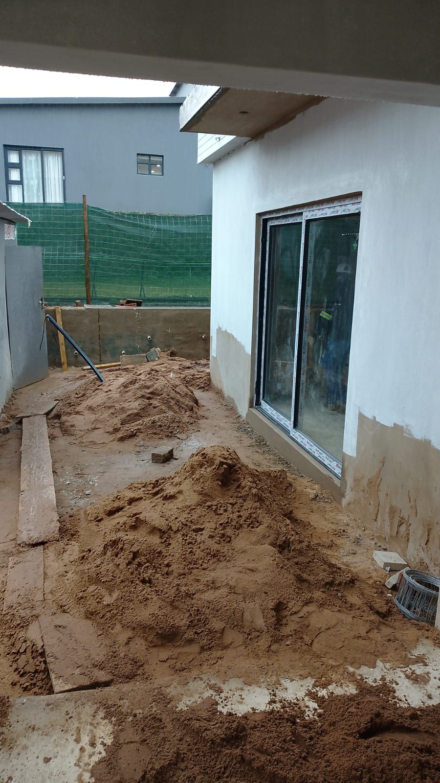 Exterior finishing work beside the property