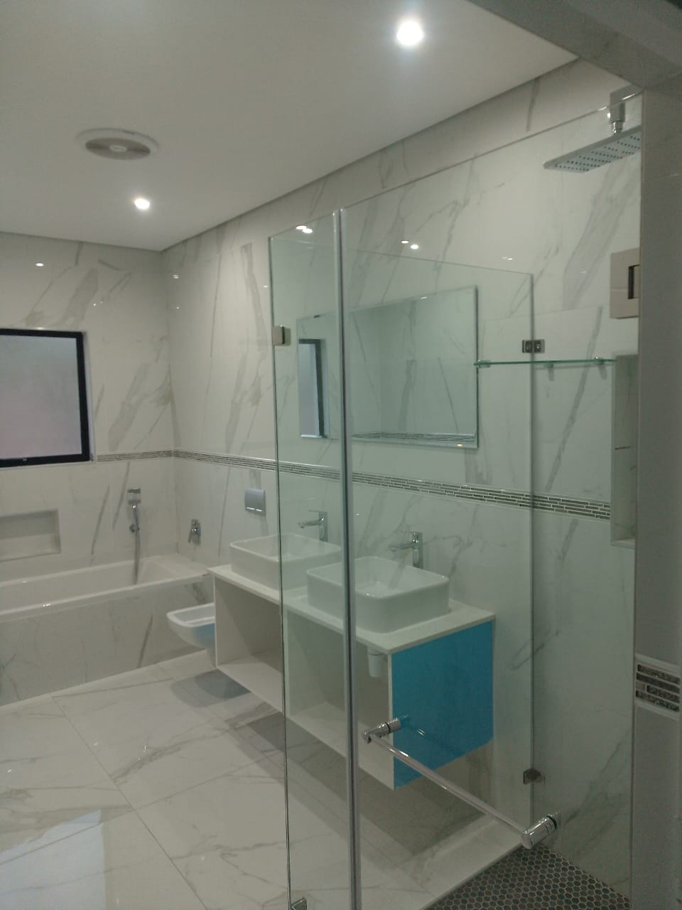 Completed bathroom with glass shower